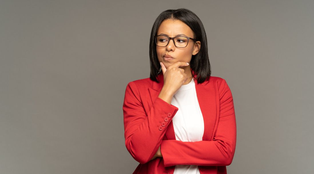 Woman pondering which website builder to choose for her business